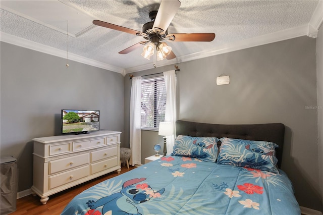 bedroom featuring dark hardwood / wood-style flooring, ornamental molding, a textured ceiling, and ceiling fan