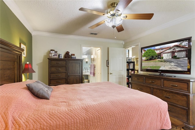 bedroom featuring ceiling fan, crown molding, a textured ceiling, and ensuite bathroom