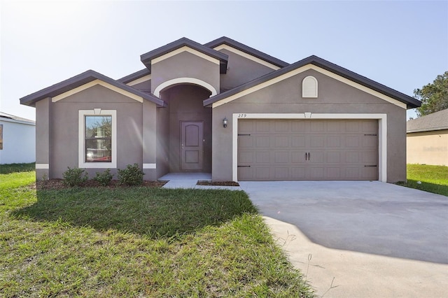 ranch-style home with a front yard and a garage