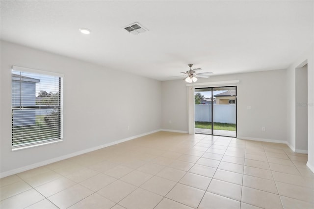 unfurnished room with ceiling fan and light tile patterned flooring