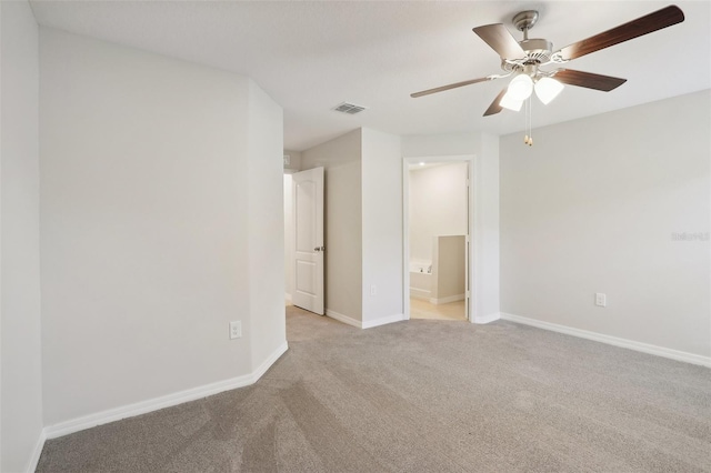 unfurnished room with ceiling fan and light colored carpet