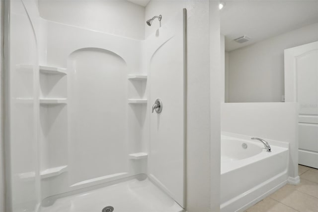 bathroom featuring tile patterned flooring and walk in shower