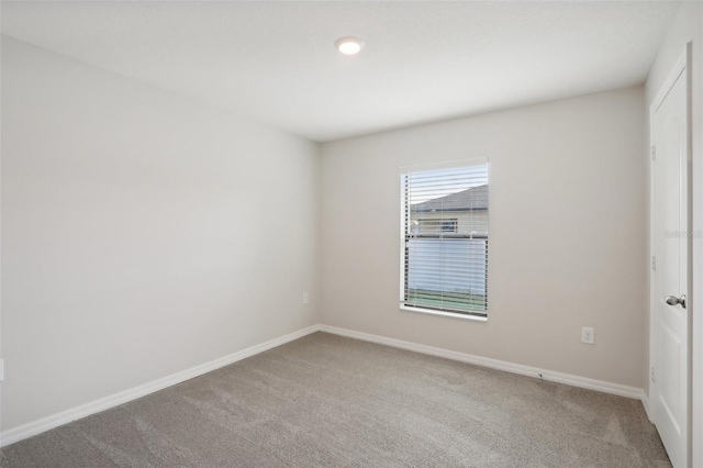 empty room featuring carpet floors