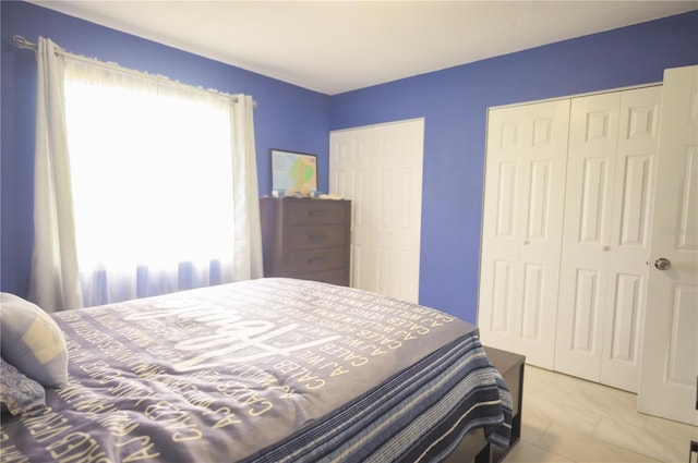 bedroom featuring multiple closets