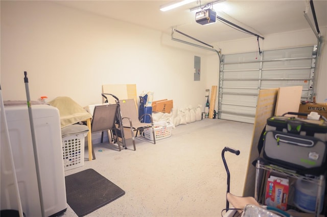 garage featuring a garage door opener and washer / clothes dryer