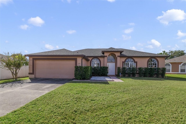 view of front of home with a garage and a front yard