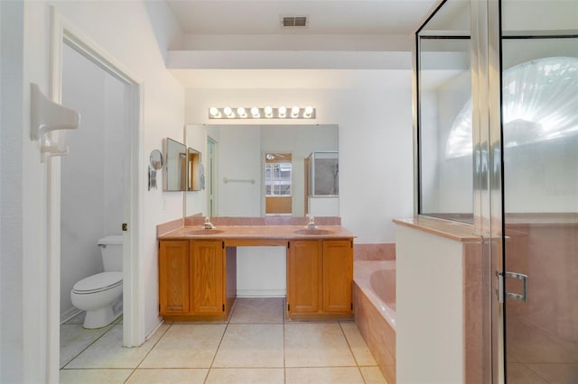 full bathroom featuring shower with separate bathtub, tile patterned floors, toilet, and vanity