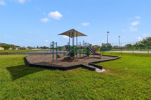 view of jungle gym featuring a lawn