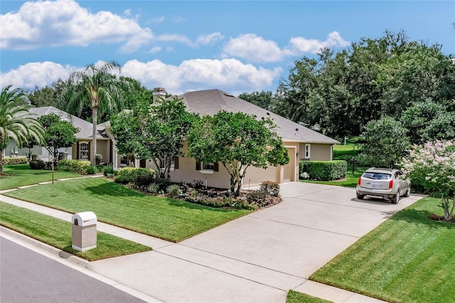 view of front facade featuring a front lawn and a garage