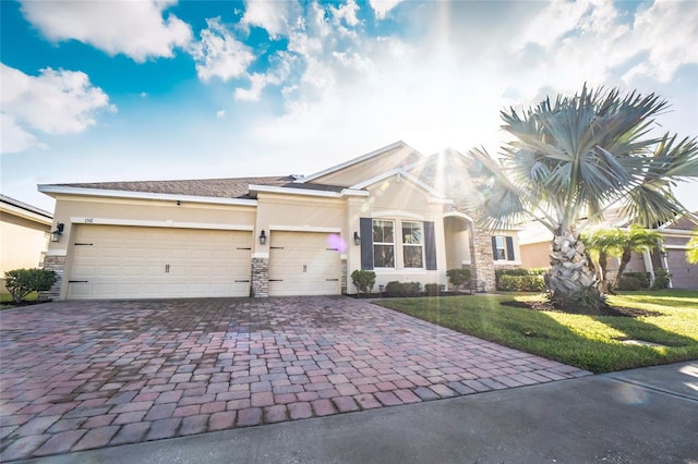 view of front facade with a front yard and a garage