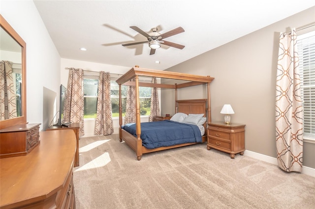 bedroom featuring ceiling fan and light carpet