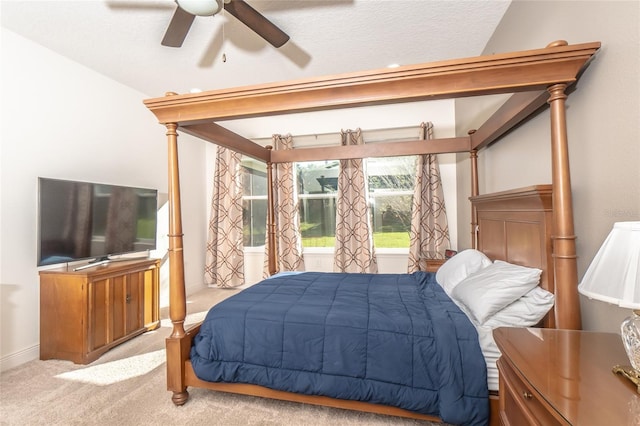 carpeted bedroom with a textured ceiling and ceiling fan