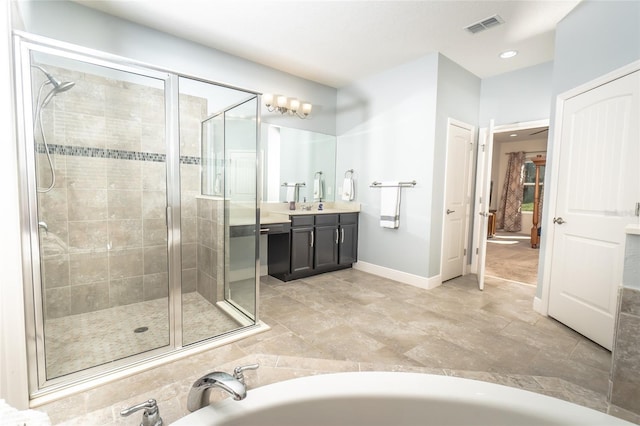 bathroom with vanity and a shower with door