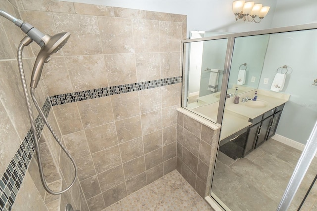 bathroom featuring vanity and an enclosed shower