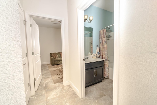 bathroom with vanity and shower / bath combo with shower curtain