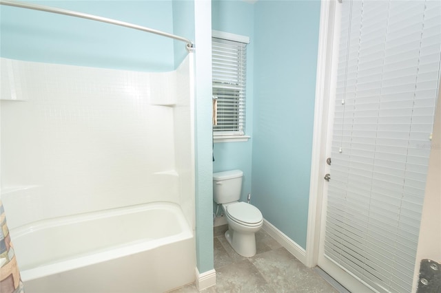 bathroom with toilet and shower / bath combo