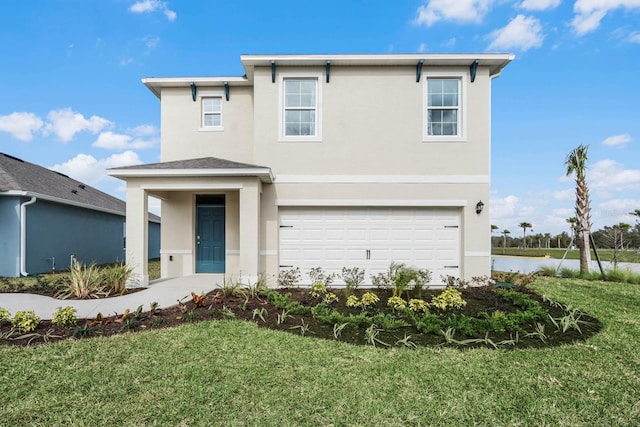 view of front of property with a front lawn and a garage