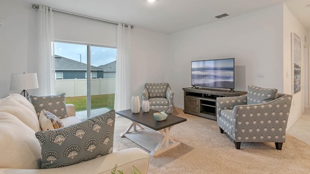 living room with light colored carpet