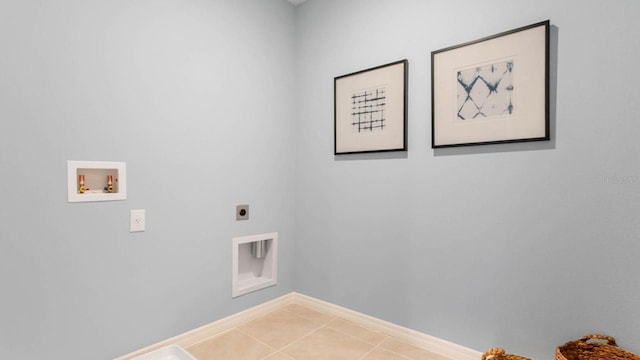 clothes washing area featuring electric dryer hookup, washer hookup, and tile patterned flooring