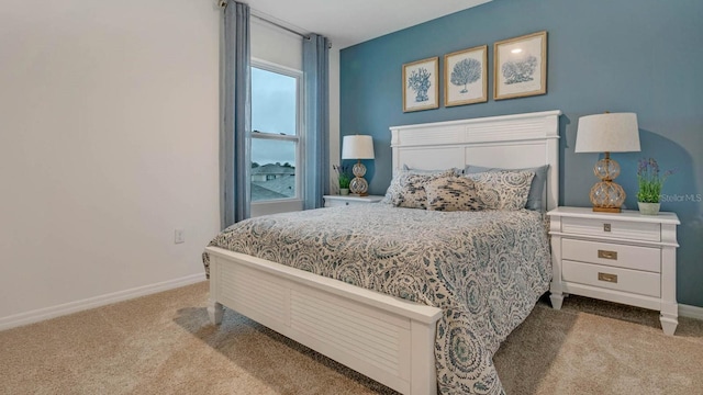 bedroom with light colored carpet