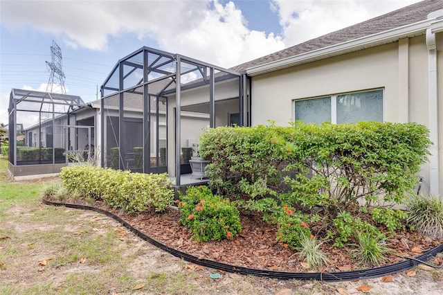 view of home's exterior featuring a lanai