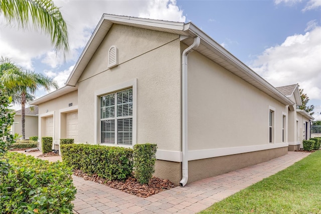 view of home's exterior with a garage