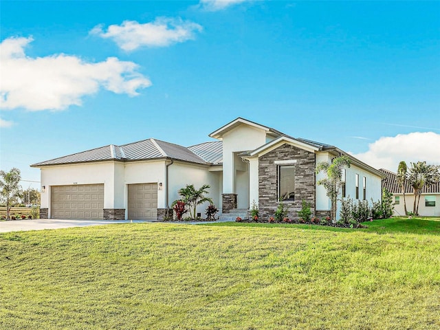 view of front of property with a front yard and a garage