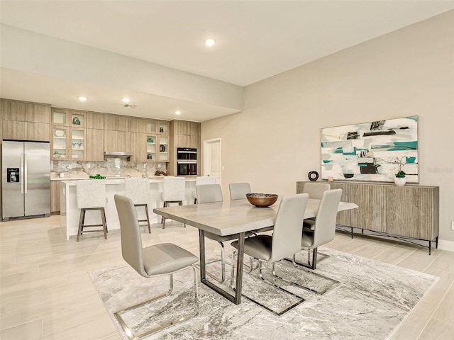 dining area featuring light wood-type flooring