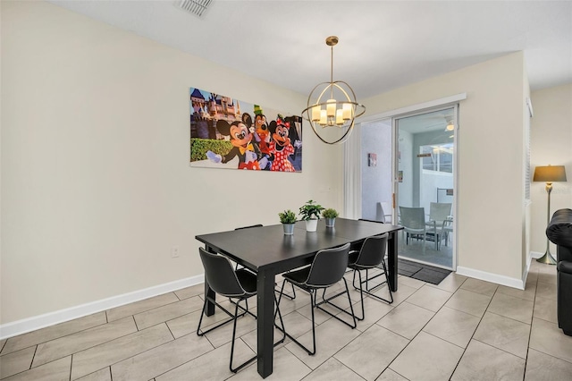 dining space featuring a notable chandelier