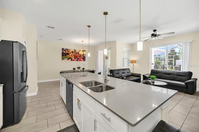 kitchen featuring white cabinets, a kitchen island with sink, dishwasher, stainless steel refrigerator with ice dispenser, and sink