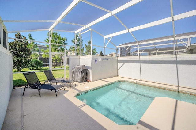 view of pool featuring a patio area, a lanai, and a yard