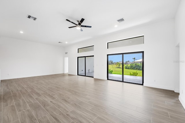 unfurnished living room with light hardwood / wood-style floors and ceiling fan