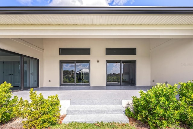 doorway to property featuring a patio