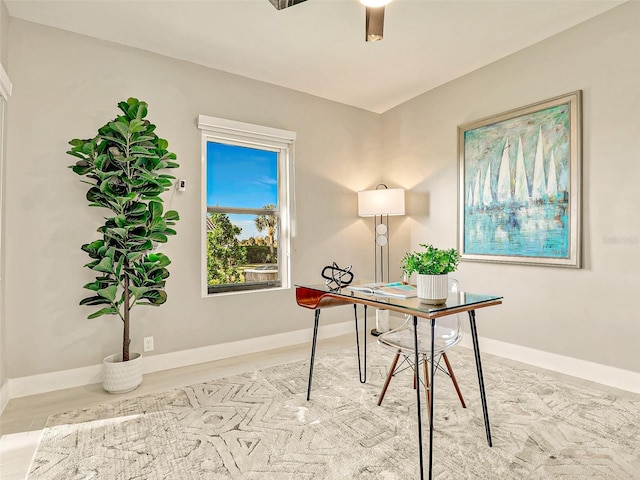 office space with light hardwood / wood-style flooring