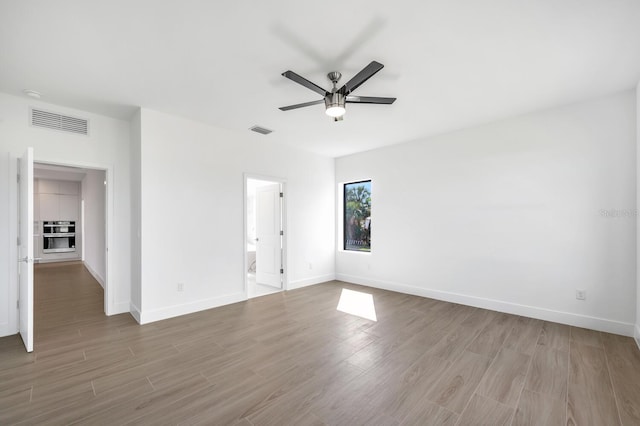 unfurnished room featuring ceiling fan and light hardwood / wood-style flooring