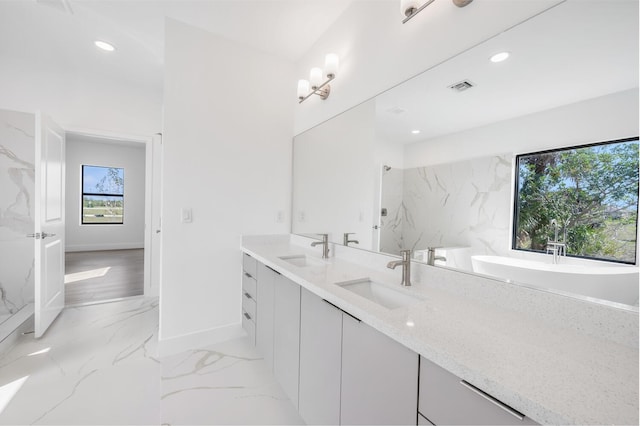 bathroom with vanity and a shower