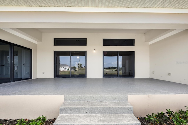 doorway to property featuring a patio