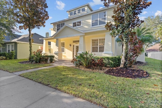 view of front of property with a front lawn and a porch