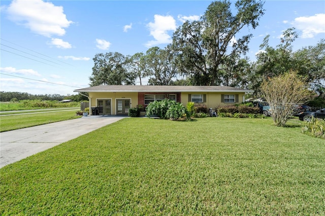 ranch-style home with a front lawn