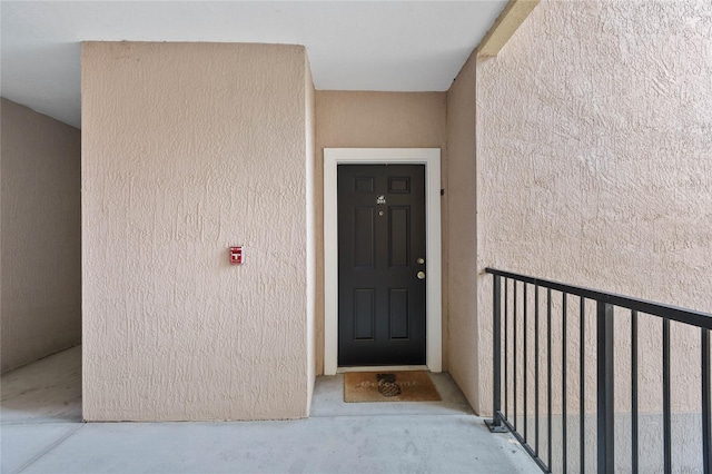 doorway to property featuring a balcony