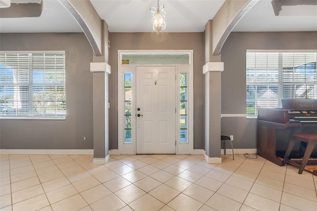 tiled foyer with a healthy amount of sunlight