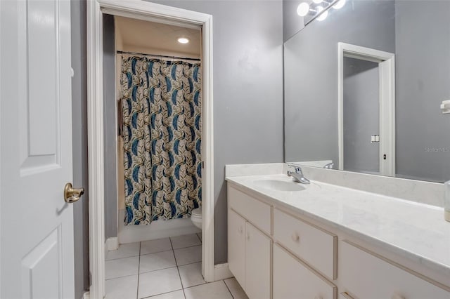 full bathroom featuring toilet, shower / bath combination with curtain, vanity, and tile patterned floors