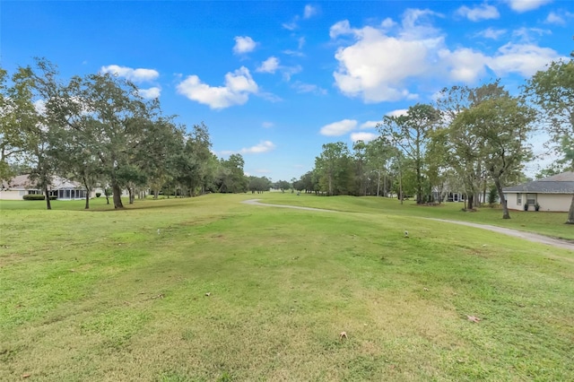 view of property's community featuring a yard