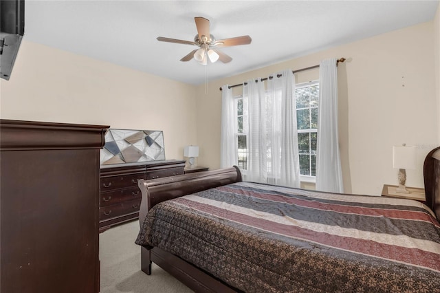 bedroom with light colored carpet and ceiling fan