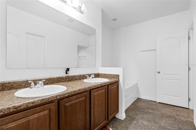 bathroom featuring vanity and a bathtub