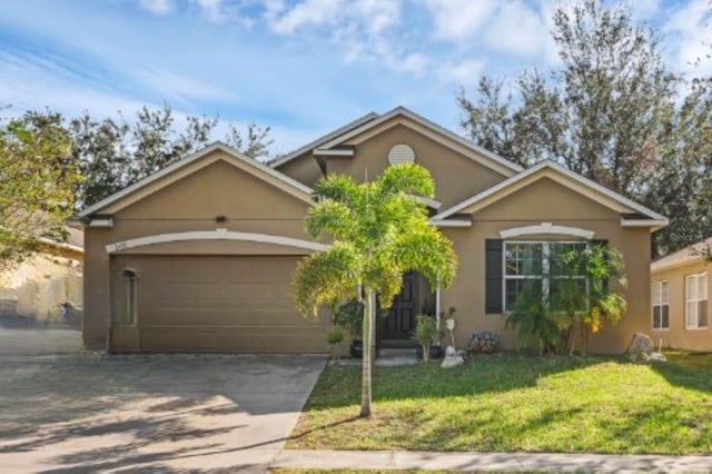 view of front facade featuring a front yard and a garage