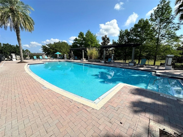 view of swimming pool featuring a patio area