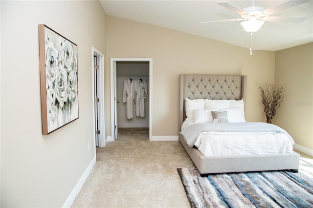 bedroom featuring ceiling fan, vaulted ceiling, and light colored carpet