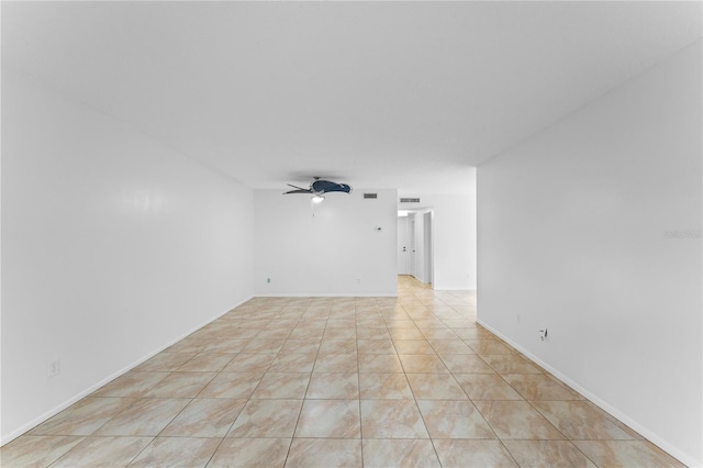 unfurnished room featuring ceiling fan and light tile patterned floors