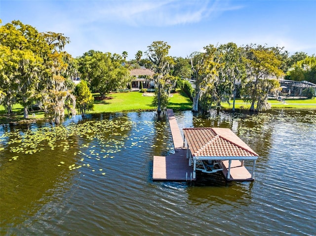 dock area featuring a water view and a yard